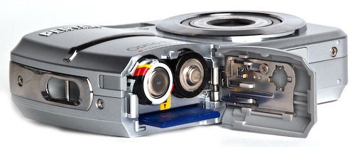 Pentax Optio E50 camera with open battery compartment.