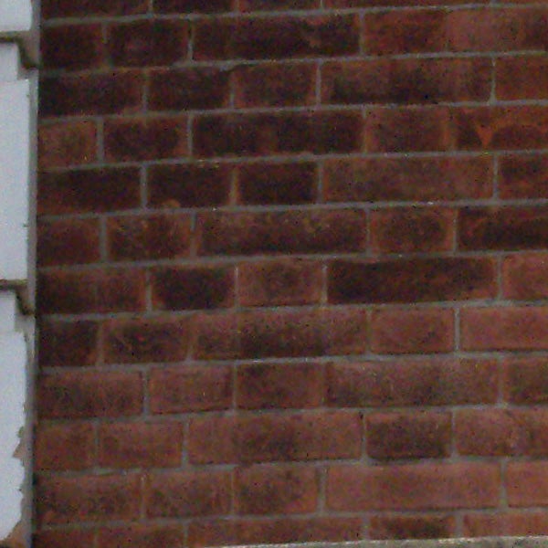 Close-up photo of a red brick wall.