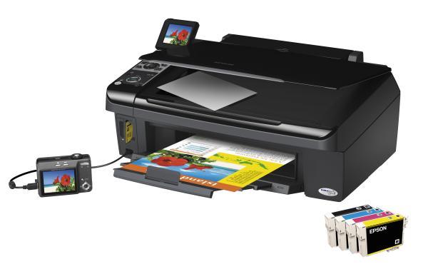 Epson Stylus SX400 printer with printed pages and ink cartridges.