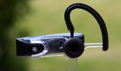 Aliph Jawbone Noise Assassin Bluetooth Headset on stand.Close-up of Jawbone Noise Assassin Bluetooth headset on stand.