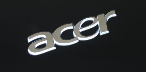 Close-up of Acer logo on a black surface.