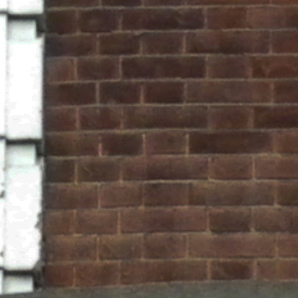 image of a brick wall, possibly due to camera shake.image of a brick wall, likely from Pentax Optio M50.