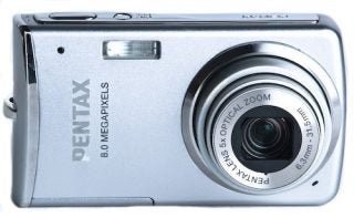 Silver Pentax Optio M50 digital camera with lens visible.