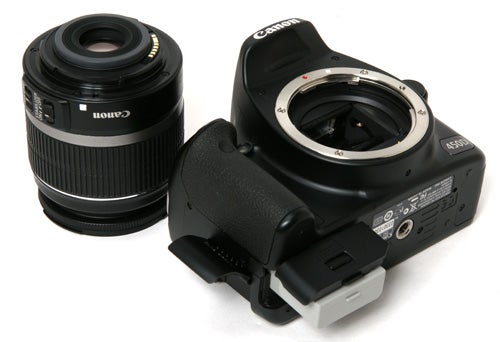Canon EOS 450D DSLR camera with detached lens.