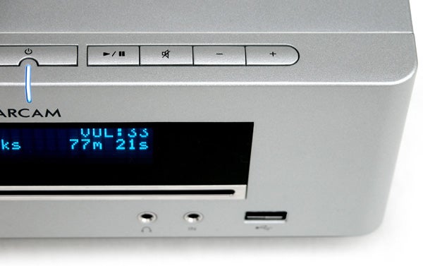 Close-up of Arcam Solo Mini system with display and controls.Close-up of Arcam Solo Mini audio system with display screen.