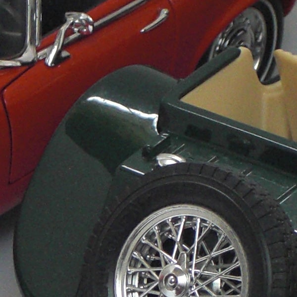 Close-up of vintage model cars showcasing camera focusClose-up of toy cars showing detail and color.