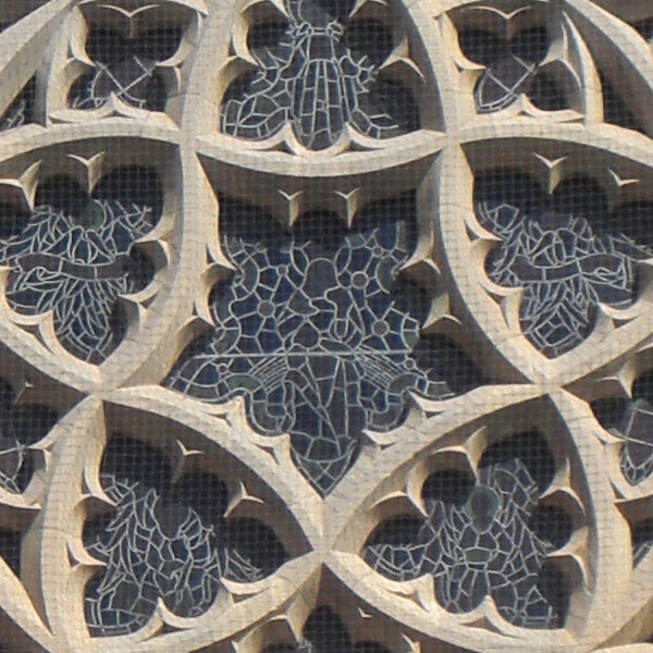 Close-up of intricate stone lattice work on a building facade.High-resolution photo of intricate stone lattice work.