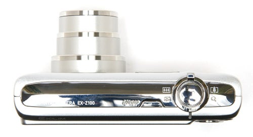 Casio Exilim EX-Z100 digital camera on white background.Silver Casio Exilim EX-Z100 digital camera side view