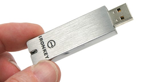 Hand holding an IronKey secure USB flash drive.Hand holding an IronKey Secure Flash Drive.