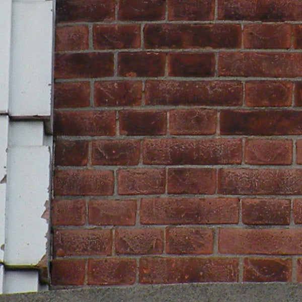 Close-up photo of a brick wall with poor image quality.Close-up of a brick wall texture with soft focus edges