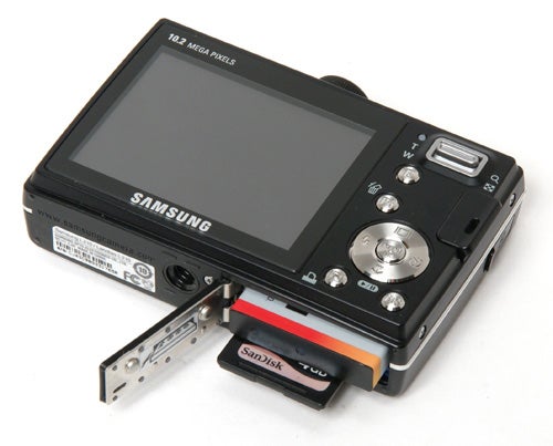 Samsung L210 digital camera with an open memory card slot.Samsung L210 digital camera with open memory card slot.