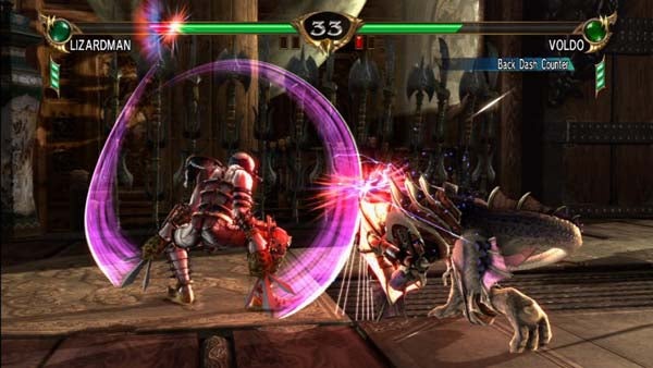 Soul Calibur IV gameplay showing Voldo fighting Lizardman.Soul Calibur IV gameplay scene with characters Lizardman and Voldo fighting.