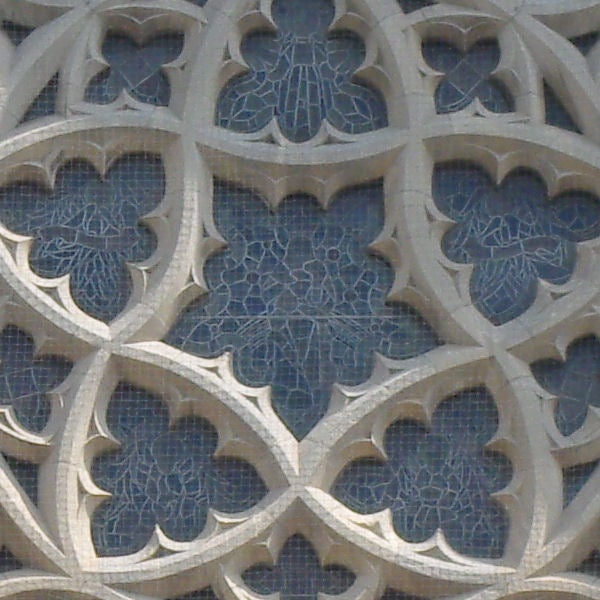 Close-up of intricate gothic style window architecture.Close-up of Gothic stained glass window patterns