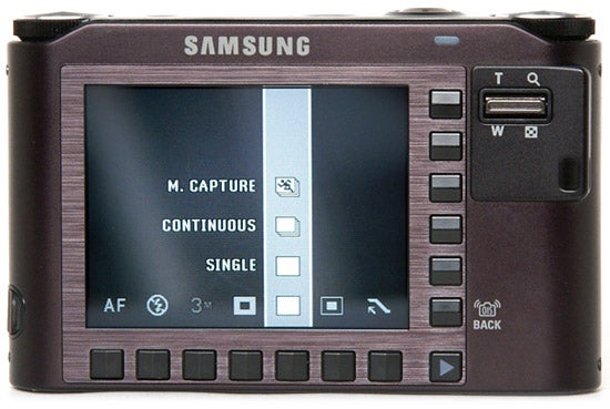 Samsung NV30 camera rear view displaying menu options.Samsung NV30 camera rear LCD screen and buttons.