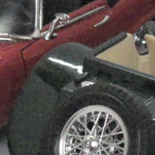 Close-up of vintage cars with focus on wheel and detailsClose-up of vintage cars with focus on wheel and bodywork