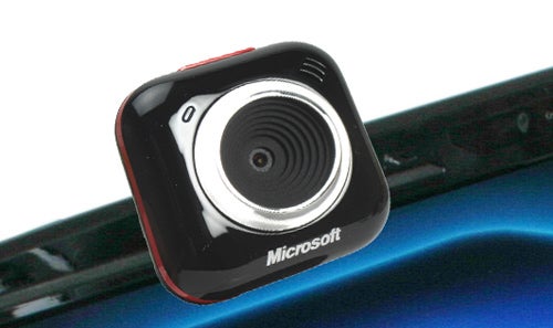 Microsoft LifeCam VX 5000 webcam mounted on laptop.Microsoft LifeCam VX-5000 webcam on a laptop lid.