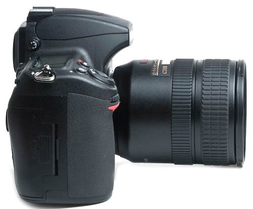 Nikon D700 DSLR camera with attached lens.Nikon D700 DSLR camera with a black lens attached.