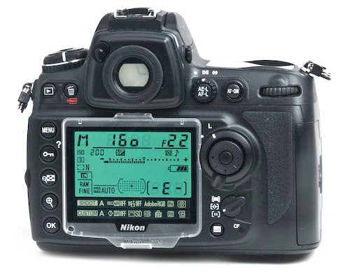 Nikon D700 DSLR camera with visible settings on LCD.Nikon D700 DSLR camera rear LCD display and controls.
