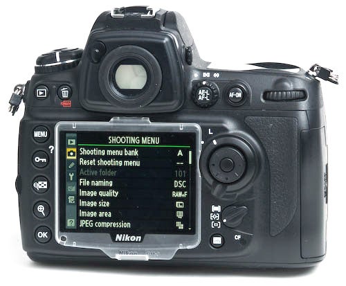 Nikon D700 camera showing its shooting menu on LCD screen.Nikon D700 DSLR camera with menu screen displayed.