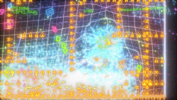 Geometry Wars: Retro Evolved 2 gameplay screenshot with vibrant effects.Colorful Geometry Wars: Retro Evolved 2 gameplay screenshot.