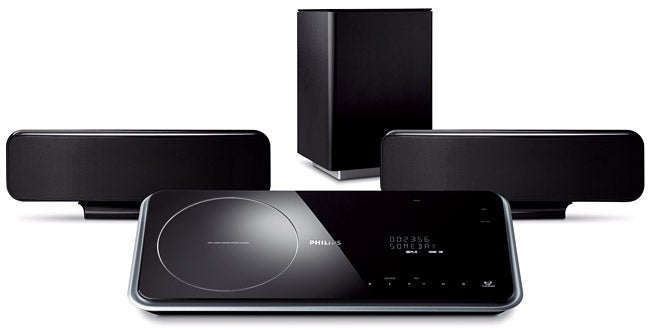 Philips home cinema system with two speakers and a subwoofer.Philips home cinema system with speakers and subwoofer.