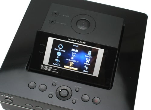 Sony Giga Juke NAS-SC55PKE wireless audio system display and controls.Sony Giga Juke audio system interface close-up.