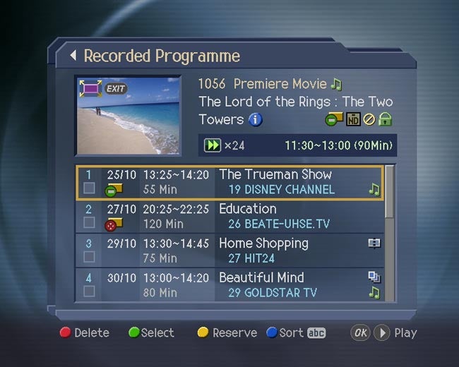 Screen displaying Humax PVR-9300T recorded TV programme list.Humax PVR-9300T interface showing recorded TV programs list.