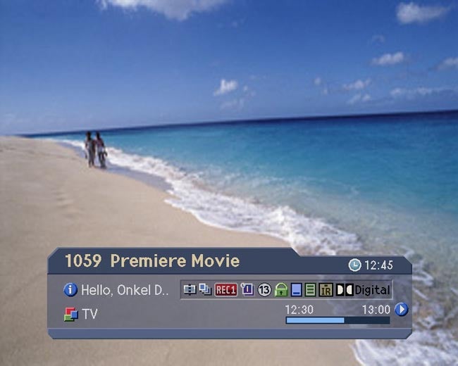 Humax PVR-9300T on-screen display over beach background.Humax PVR interface on beach background with on-screen TV guide.
