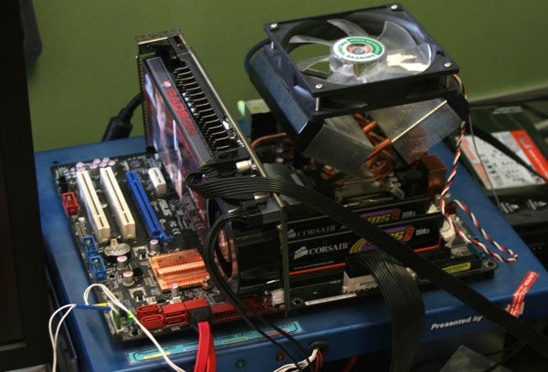 ATI Radeon HD 4870 X2 graphics card in a computer setup.Radeon HD 4870 X2 graphics card installed in a test bench setup.