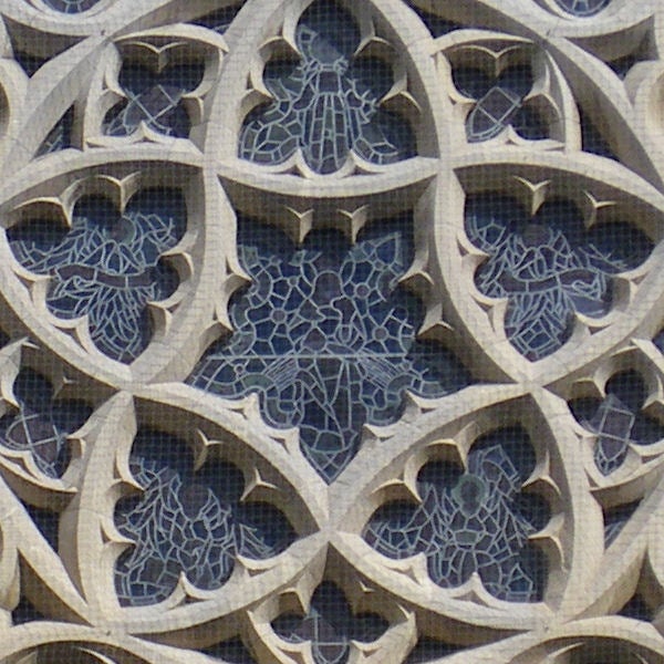Intricate stone lattice work with geometric patterns.Patterned architectural stone lattice work.