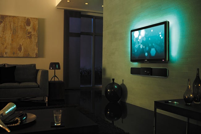 Philips Cineos LCD TV displayed in a modern living room.Philips Cineos LCD TV mounted in a modern living room at night.