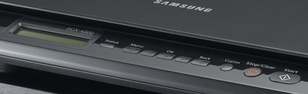 Close-up of Samsung SCX-4300 printer control panel.