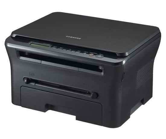 Samsung SCX-4300 multifunction laser printer on white background.Samsung SCX-4300 multifunction laser printer on a table.