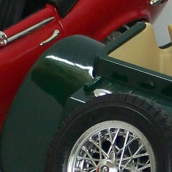 Close-up of vintage car wheel and fenderClose-up of a classic car wheel and fender