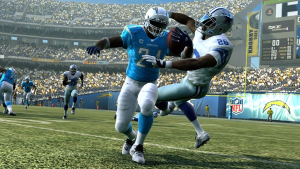Screenshot of Madden NFL 09 gameplay showing a tackle.Madden NFL 09 gameplay screenshot with players tackling.