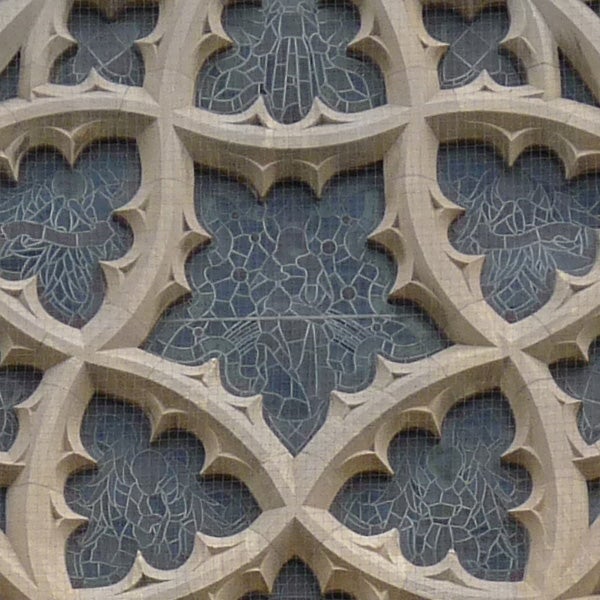 Close-up of intricate stone window tracery patternsDetailed stonework of gothic architecture zoomed in.