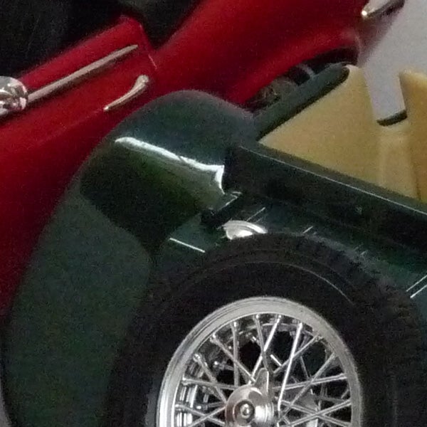 Close-up of classic car model wheel and fender.Close-up of a toy car taken with Panasonic Lumix DMC-FZ28.