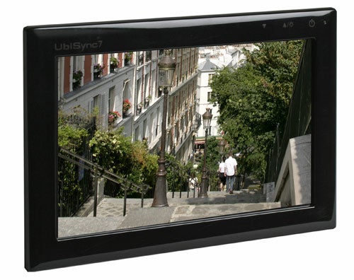 Samsung SyncMaster auxiliary monitor displaying street view.Samsung SyncMaster secondary monitor displaying street scene.