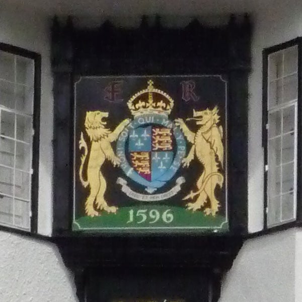 photo of a heraldic plaque with lions and a crownPhoto of an emblem with lions and a date from 1596.