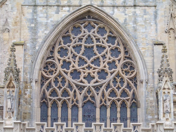 Intricate gothic window architecture of medieval church.Intricate gothic window architecture with stone tracery detail
