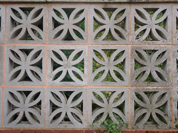 Decorative concrete block wall with geometric patternsDecorative concrete block wall with symmetrical patterns
