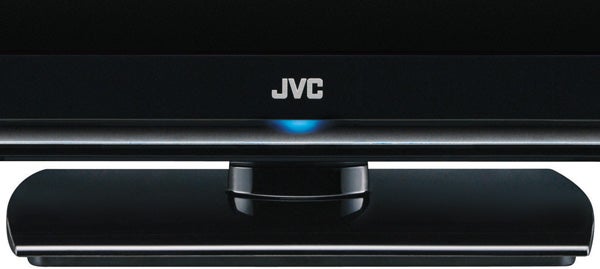 Close-up of JVC 32-inch LCD TV logo and stand.Close-up of JVC logo on a black LCD TV base.