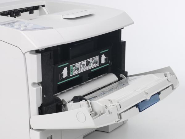 Ricoh Aficio printer with open paper tray and toner access.Ricoh Aficio SP 4100N printer with open panels.