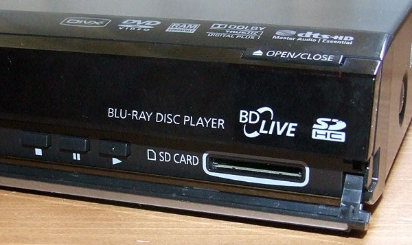 Close-up of Panasonic DMP-BD35 Blu-ray Player with SD card slot.