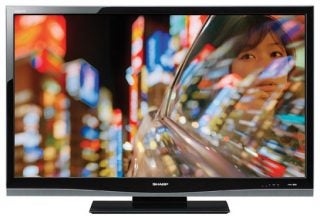 Sharp LC-37XL8E 37-inch LCD TV displaying vivid cityscape content.