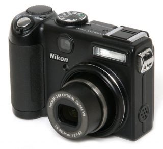 Nikon CoolPix P5100 camera on white background.