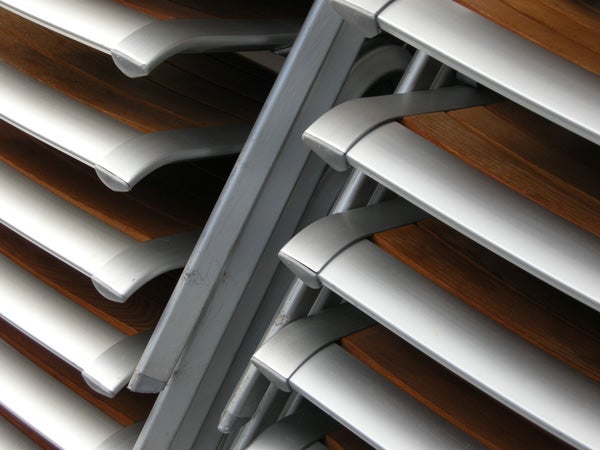 Close-up of metallic and wooden bench slats.Close-up photo of modern architectural details captured with Nikon CoolPix P5100.