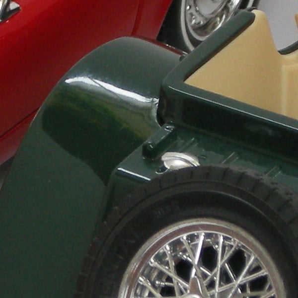 Close-up photo of a scale model car wheel and fender.Close-up of model cars showcasing Nikon CoolPix P5100 image quality.