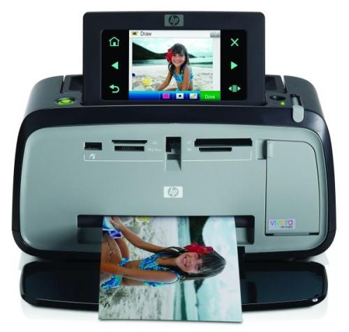 HP Photosmart A636 photo printer with printed picture.
