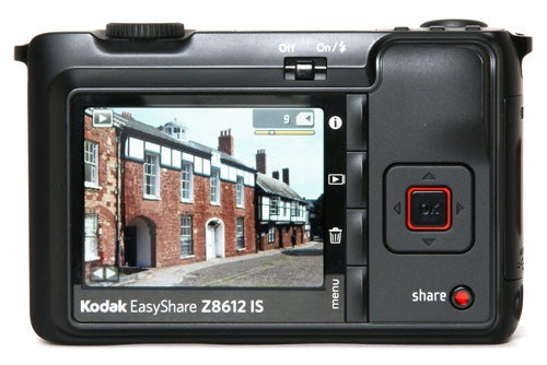 Kodak EasyShare Z8612 IS digital camera displaying a photo on screen.Kodak EasyShare Z8612 IS digital camera displaying a street scene.